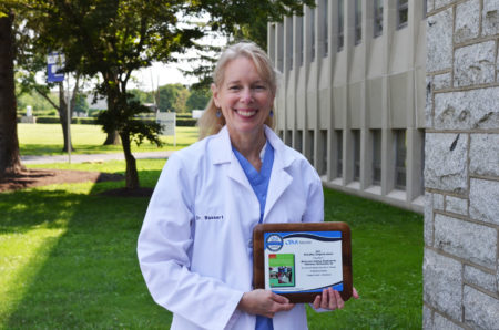 Dr. Joanna Bassert with award