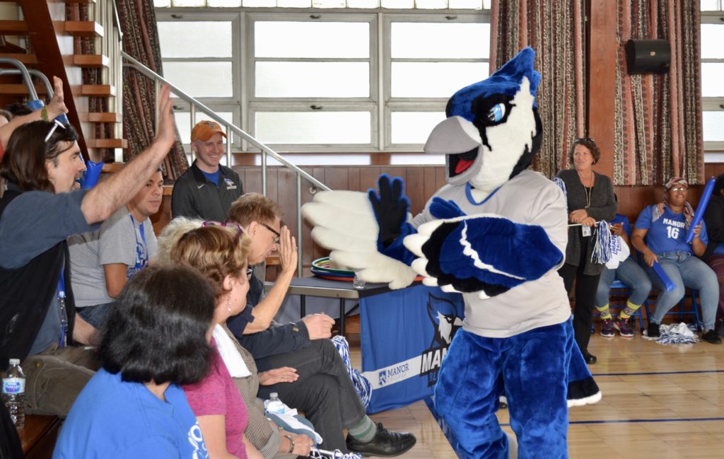 Manny the Mascot greeting the crowd at Manny's Madness 