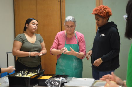 students make Ukrainian pierogi