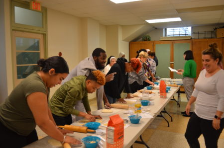 students bake bread together