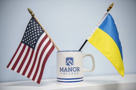 Ukrainian and American flag in a Manor College mug