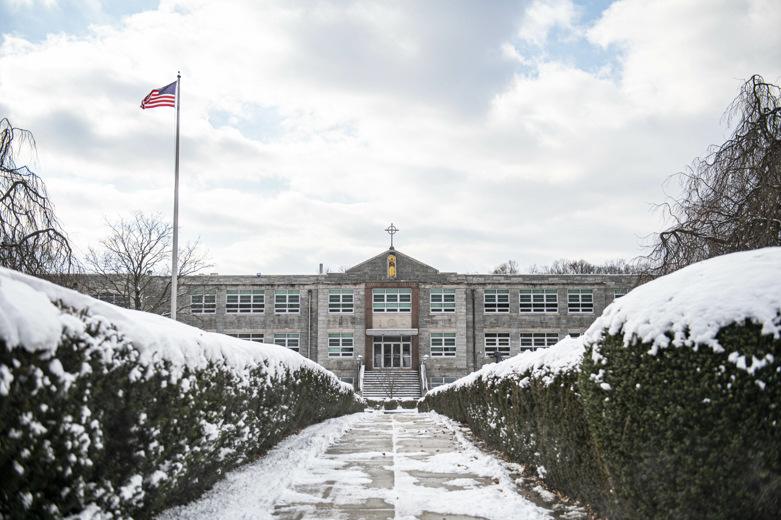 Snowy Manor campus with American flag