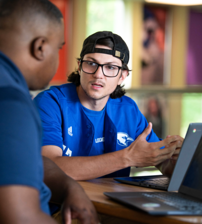 Manor College student studying in the library.